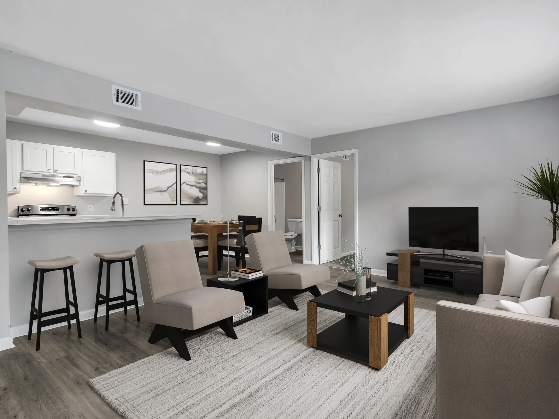 Staged living room, dining area and kitchen at Crescent Ridge