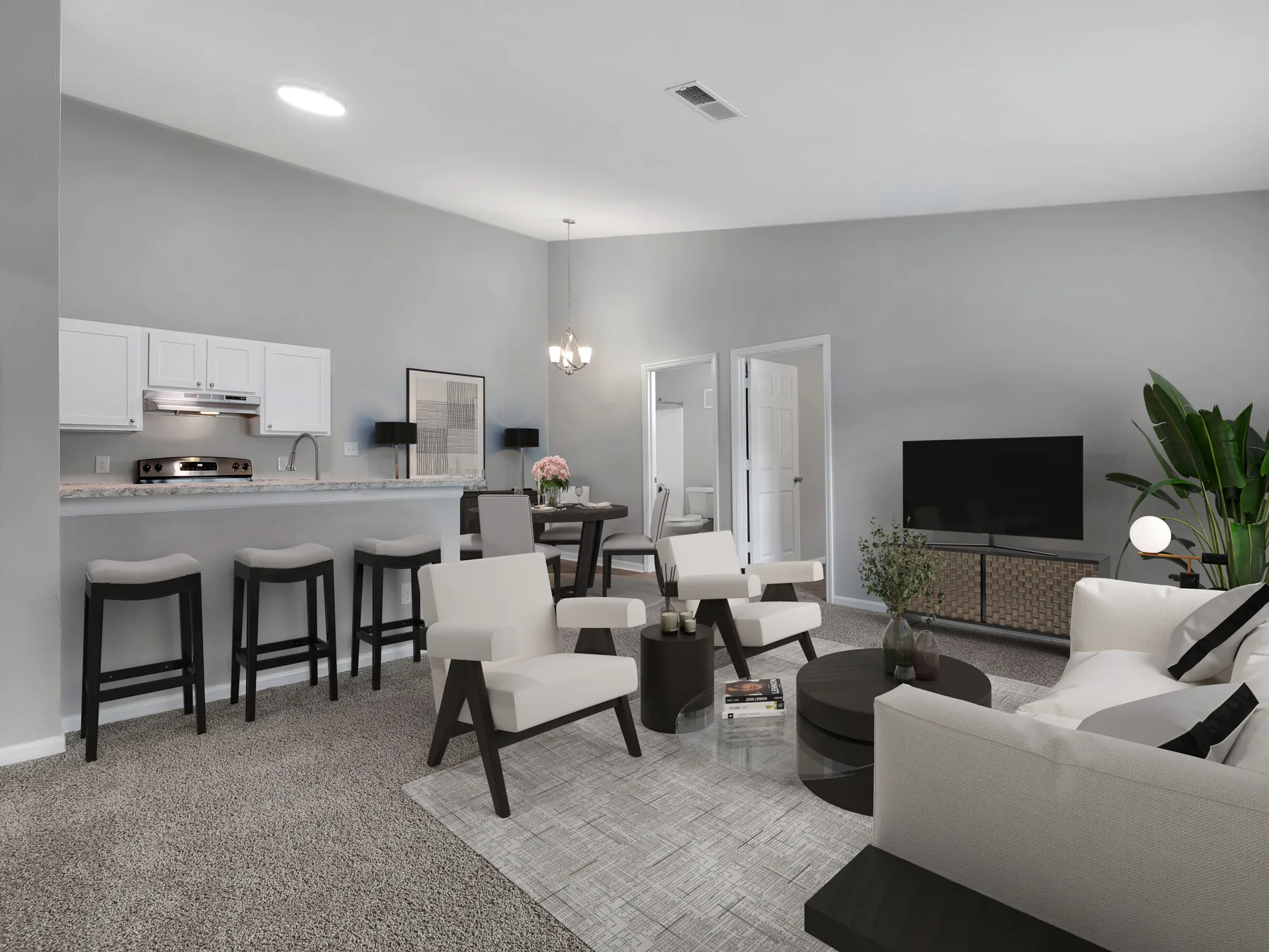 Staged living room with high ceilings, breakfast bar and dining set at Crescent Ridge